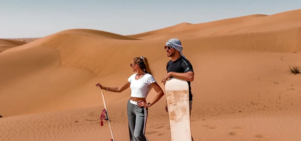 sand-boarding in evening desert safari